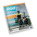Titelblatt des Magazins „ElektroRad“ mit zwei radfahrenden Personen – eine weiblich, eine männlich – in Fahrradhelmen und Sportkleidung auf E-Bikes vor Bergkulisse. Hauptüberschriften: „Für neue Horizonte – 13 SUV-Bikes mit High-End-Technik“, „Test: 11 Sättel für top Sitzkomfort“, „Fränkische Schweiz: Ein Paradies für Radler“ und „Sommerglück: Hitze-Tipps für Mensch und Maschine“. Oben links hellblaues Feld mit weißem „Rad“-Logo.