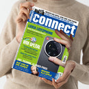 Person mit beigem Pullover hält das Technikmagazin „connect“ in der Hand. Auf dem Titelbild mit blau-grünem Hintergrund stehen Texte wie „LEICA LEITZPHONE“, „WM-SPEZIAL“, „AUF UND IN DIE OHREN“ und „BESSER ALS APPLE“. Abgebildet sind eine Detailaufnahme einer Smartphone-Kamera mit „LEICA“-Logo sowie ein Mann mit Kopfhörern links unten.