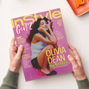 Magazincover der Ausgabe „InStyle Gen Z“ in pink-lilafarbenem Layout mit gelber und weißer Schrift. Im Zentrum sitzt eine weibliche Person mit lockigem dunklem Haar, weißem Top und schwarzem Rock. Textaufschriften u. a.: „OLIVIA DEAN“, „7 Gründe, die sie zur neuen Icon ihrer Generation machen“, „Sus? Oder hilfreich?“, „NO MORE CRINGE“ und „WE DON’T GATEKEEP!“. Zwei Hände halten das Magazin über hellem Hintergrund.