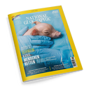 Titelblatt der Zeitschrift „National Geographic“ mit gelbem Rand und dem Hauptmotiv eines kleinen rosafarbenen Ferkels, das in blauen Latexhandschuhen gehalten wird, auf hellblauem Hintergrund. Aufschrift: „Dieses Schwein kann Menschen retten“, dazu Untertitel über die Möglichkeit, tierische Organe zur Heilung zu nutzen. Weitere sichtbare Themen: Biber als Landschaftsschützer, Pluto-Debatte und Wasserbewahrung in Wüsten.