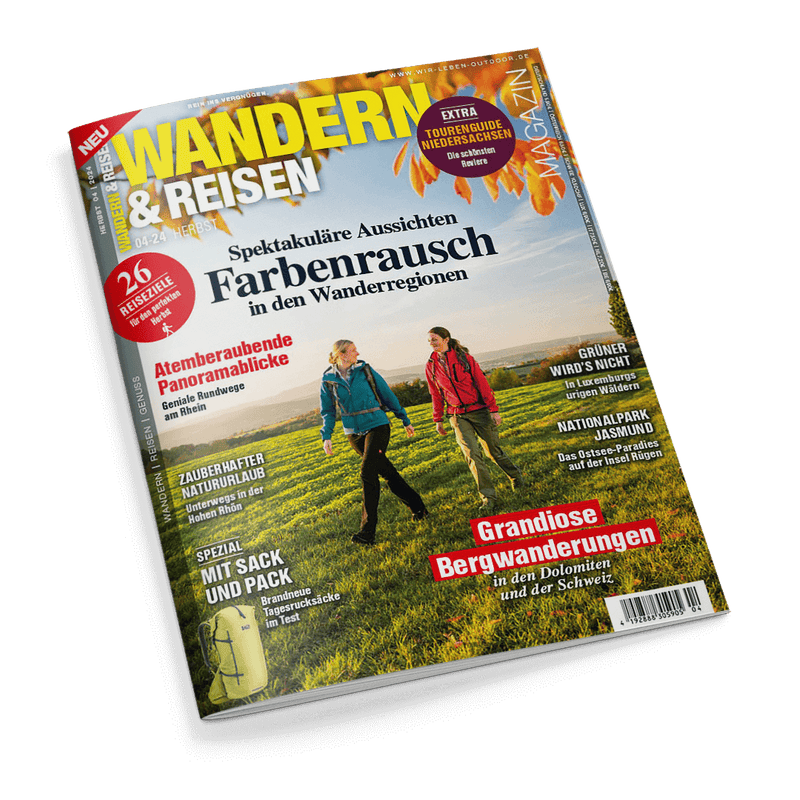 Titelbild der Zeitschrift „Wandern & Reisen“ (Ausgabe 04/24, Herbst) mit zwei wandernden weiblichen Personen auf einem grünen Feld vor Landschaftshintergrund, Titelschlagzeilen u. a.: „Farbenrausch in den Wanderregionen“, „26 Reiseziele“, „Grandiose Bergwanderungen in den Dolomiten und der Schweiz“, „Zauberhafter Natururlaub“ sowie ein abgebildeter gelber Wanderrucksack unten links.