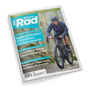 Titelblatt der Zeitschrift „Elektro Rad“ mit hellblauem Logo oben links, Unterzeile „E‑Bikes für Pendler & Abenteurer“. Im Mittelpunkt fährt eine lächelnde männliche Person in Helm, Sonnenbrille und kariertem Hemd auf einem schwarzen Gravelbike durch einen Waldweg. Textzeilen: „Flotter auf Schotter – 11 Gravelbikes mit Spaß‑Garantie“, „Der perfekte Sattel? Darauf kommt es an.“, „Rushhour‑Tipps vom Verkehrs‑Experten“.