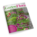 Titelbild der Zeitschrift „GartenFlora“ Ausgabe April 2025 mit großem Foto eines bunt blühenden Frühlingsgartens voller violetter, rosa, weißer und gelber Tulpen neben einer Holzbank; Aufschriften unter anderem: „Frühling im Farbenrausch“, „Gut kombiniert: Farbige Blätter, Blüten und Rinden“, „Lange Blütenfreude: Primeln für Beet und Topf“, „Zum Bestellen: Erdbeeren für die Sommerernte“, Magazinlogo oben in grün-pinker Schrift, Themenhinweise in pinkem Kreis unten links.