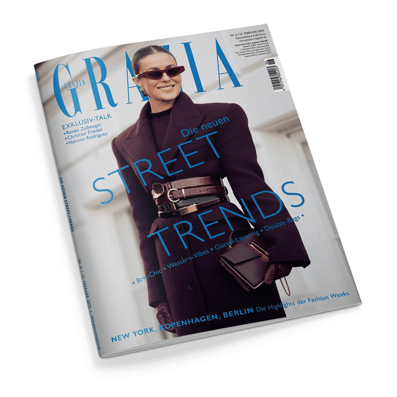 Titelbild der Zeitschrift „Grazia“, Ausgabe Nr. 6 vom Februar 2025; zentrale Abbildung einer lächelnden weiblichen Person mit dunklem Mantel, breitem Taillengürtel und kleiner brauner Handtasche, dunkelrote Sonnenbrille und zurückgebundenes Haar; Titelaufschrift: „Die neuen Street Trends“, darunter Themen wie „Brit-Chic“, „Western-Vibes“, „Gurke-Layering“, „Double-Bags“; weitere Aufschrift: „NEW YORK, KOPENHAGEN, BERLIN – Die Highlights der Fashion Weeks“.