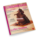 Titelbild der Zeitschrift „Feinschmecker“ mit einer Skulptur aus gestapelten Schokoladenstücken und fließender Schokoladensoße vor hellbeigem Hintergrund. Überschriften: „Schokolade! Die Sieger des großen Tafel-Tests“, „Trendziel Tokio“, „Südtirols Aufsteiger“, „Schnitzel & Schmankerl“ und „Kaffee-Genuss – Neue Maschinen und Geräte für jeden Geschmack“. Magentafarbener Schriftzug „FEINSCHMECKER“ am oberen Rand.