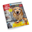 Schräg dargestelltes Magazin „Ein Herz für Tiere“ mit rotem Titelbereich und Logo des Deutschen Tierschutzbundes auf schwarzem Hintergrund. Das Cover zeigt zentral einen hellbraunen Hund, außerdem Katzen, Chinchilla, Wellensittiche, Pferde, Gorillas und ein Nagetier; sichtbare Texte sind „Graue Schnauze, goldenes Herz“, „Haustier-Ratgeber“, „Chinchilla“, „Wohlbefinden“, „Natur pur“, „Papa-Tiere“, „Neusiedler See“ und „Herbst-Spezial“.