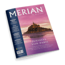 Reisemagazin „MERIAN – The Art of Travel“ mit violettem Cover, zentralem Foto der Abtei Mont-Saint-Michel bei Sonnenuntergang, darüber der Titel „JENSEITS VON PARIS“ und Unterzeile zu Reisezielen in Nordfrankreich; linke Spalte mit Themenvorschau u. a. „Magischer Oman“, „Viva Valencia!“, „Legendäre Hotelbars“ und „Bodensee“, Logo „Mit Google Maps Service“ unten links.