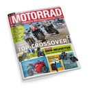 Schräg fotografiertes Titelbild der Zeitschrift „MOTORRAD“ auf weißem Papier vor schwarzem Hintergrund. Die rote Titelfläche trägt „GRÖSSTE MOTORRADZEITSCHRIFT“; abgebildet sind mehrere Motorräder sowie Motorradfahrende in Schutzkleidung, deren Geschlecht nicht erkennbar ist. Sichtbare Themen: „JAPANS TOP-CROSSOVER“, „BMW-NEUHEITEN“, „HONDA CB 1000 GT“, „KAWASAKI VERSYS 1100 SE“, „SUZUKI GSX-S 1000 GX“ und „DUCATI PANIGALE V4/V4 S“.